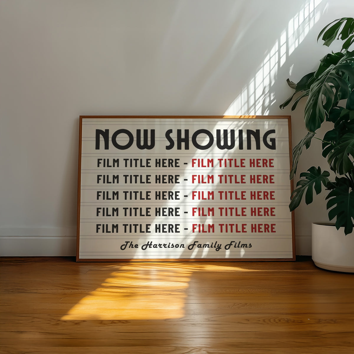 A well lit living room with a vintage poster on the wall saying "NOW SHOWING" and listings of custom movie titles. The art says "Lights. Camera. Action" and is a perfect addition to a home cinema or theatre